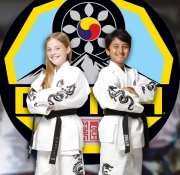 Mixed race group of cute children wearing Keikogi during Karate practice